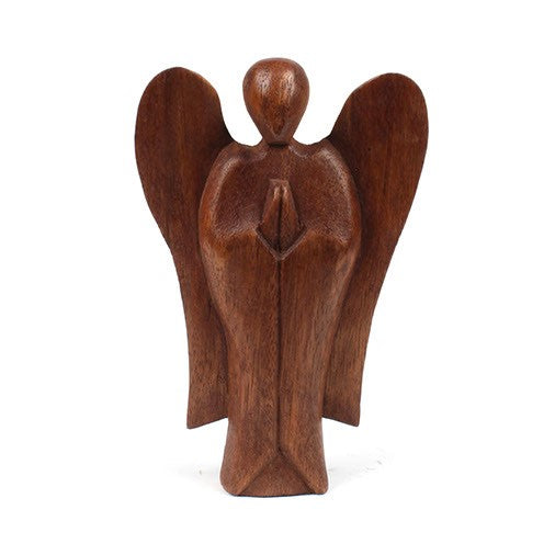 Front view of small abstract angel carved from stained wood, white background