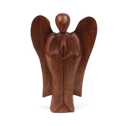 Front view of small abstract angel carved from stained wood, white background