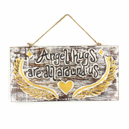 Front view of Angel Hugs carved wood plaque on white background, showing whitewashed grain, gold wings and twine hanger