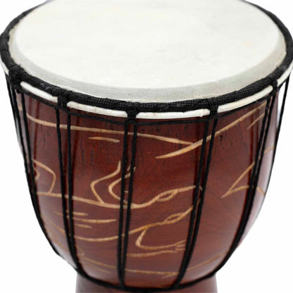 Close-up of goatskin head and black cord lacing on carved gecko djembe drum, Indonesia