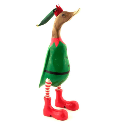 Carved bamboo root elf duck with fabric bell hat, candy-stripe legs and red boots, side view on white background