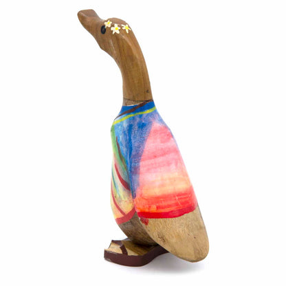 Side view of hand-painted bamboo root duck with blue and pink tie-dye finish, Indonesia