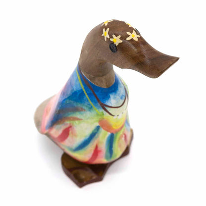 Three-quarter overhead view of Balinese bamboo duck with flower headband and multicolour body