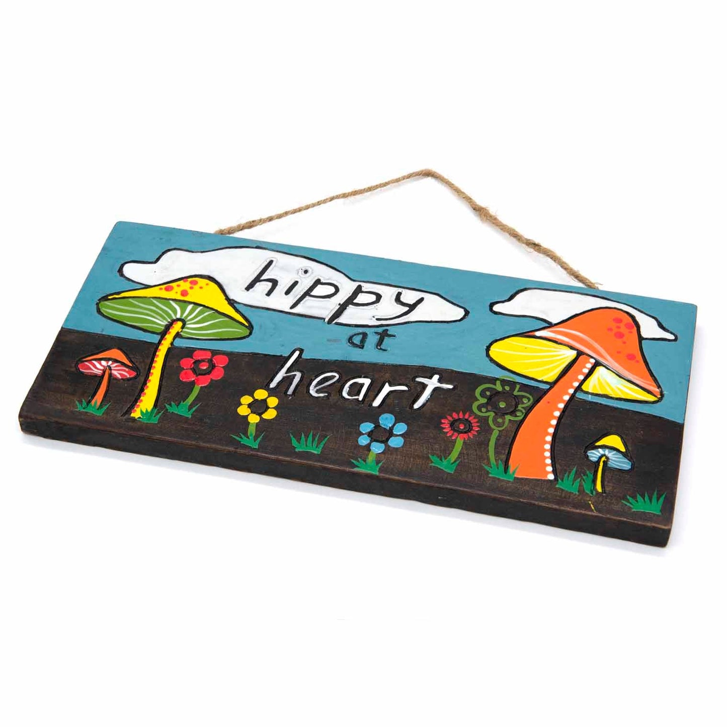 Angled side view of Hippy at Heart plaque showing carved wood depth and hand-painted toadstool and flower detail