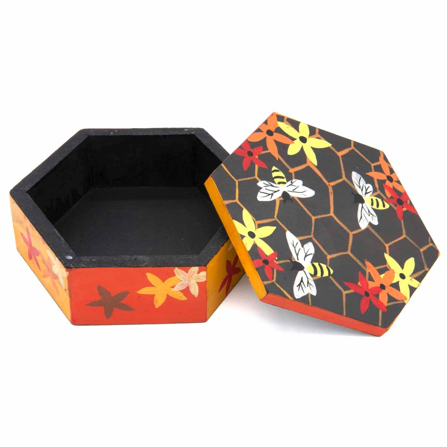 Hexagonal bee box with lid removed showing black interior, honeycomb and bee lid design, Indonesia