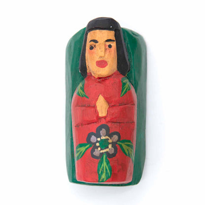Carved wood baby Jesus figure, top view, red and green painted manger with flower detail, Indonesia