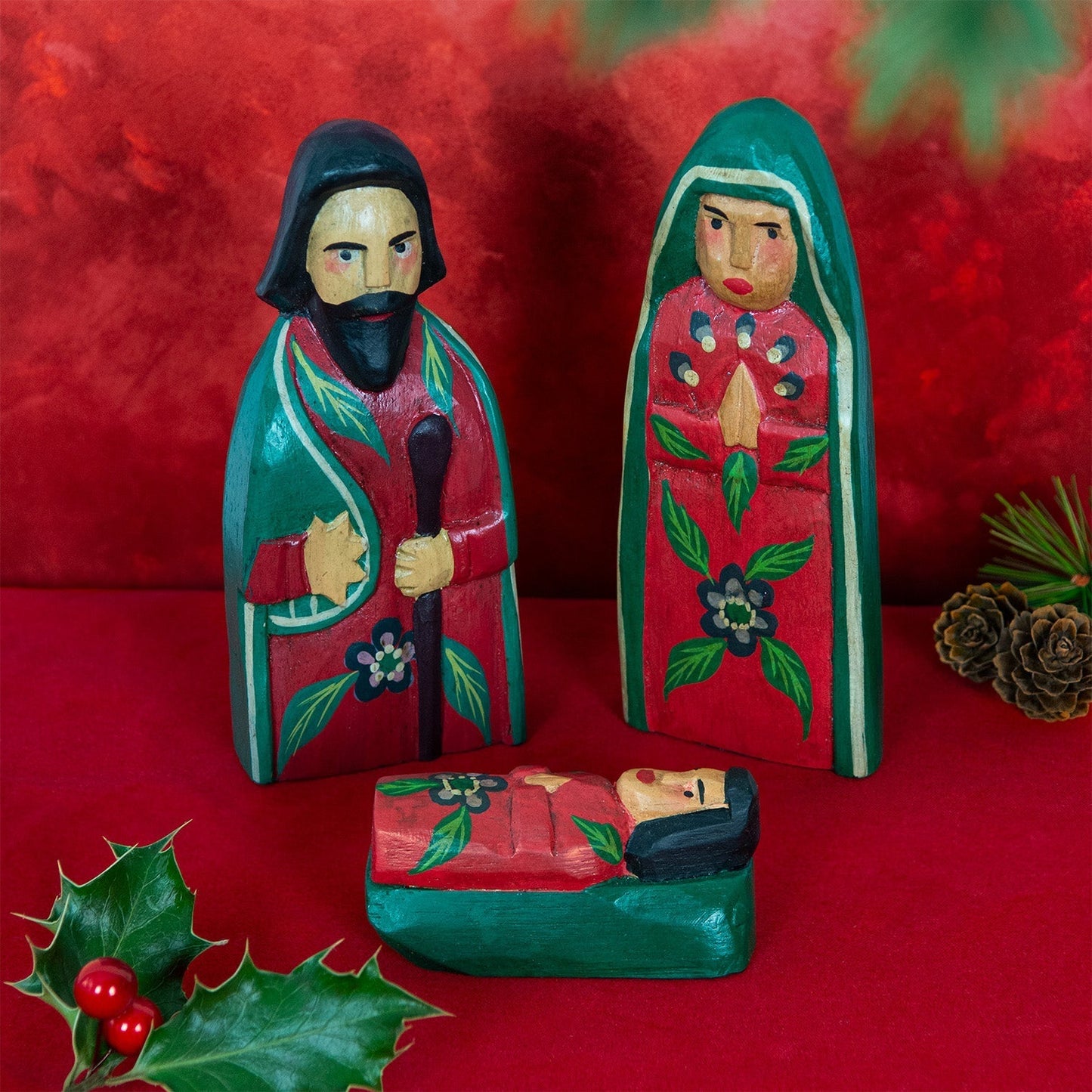 Hand-carved wood nativity set, Joseph, Mary and baby Jesus in red and green paint with floral detail, Indonesia, festive sett