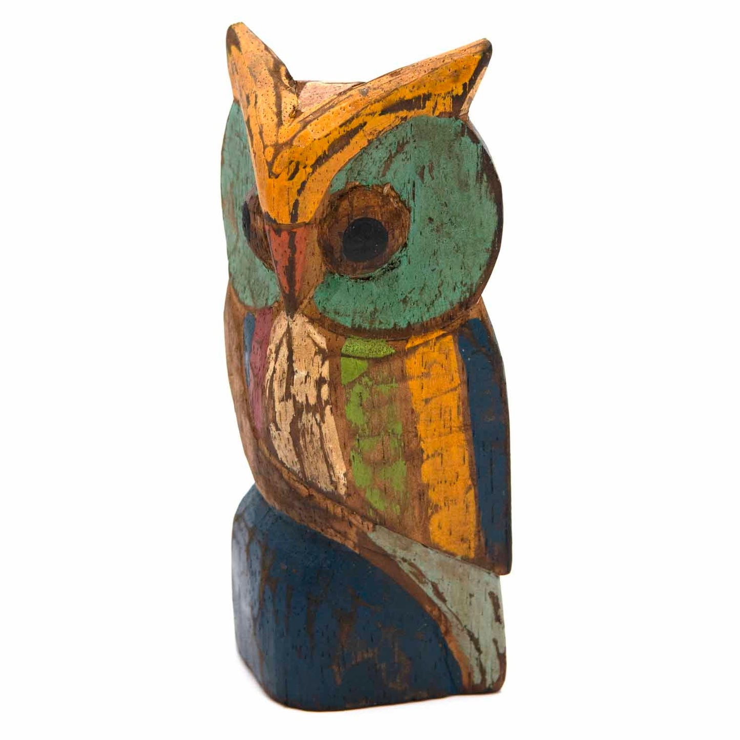 Painted wooden owl carving, three-quarter left view showing teal eye and orange ear tuft