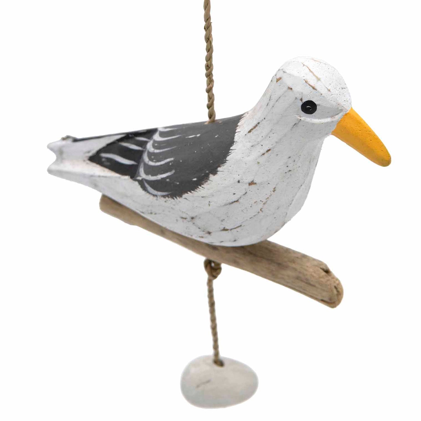 Painted wooden seagull on driftwood bar, three-quarter view showing grey wing detail