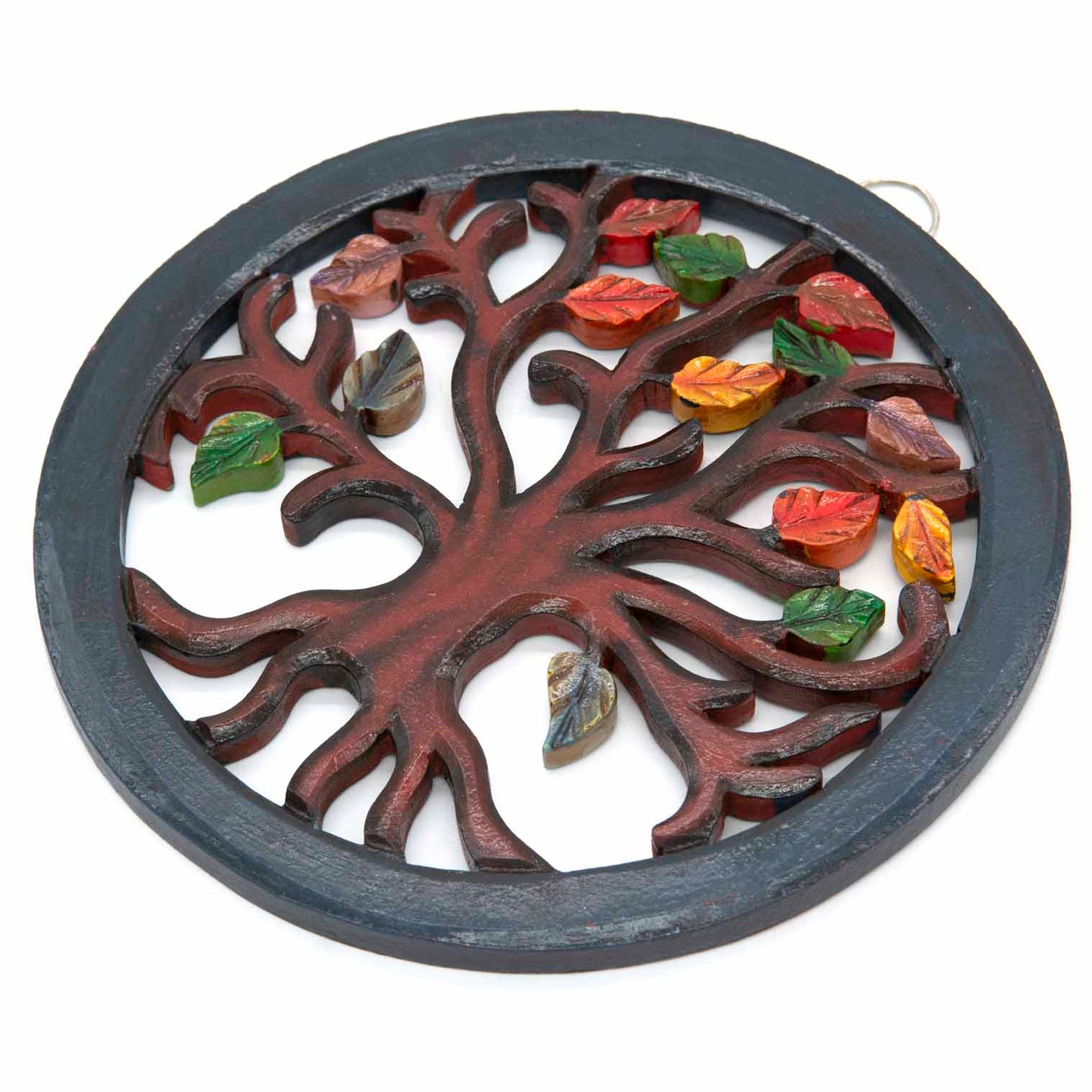 Tree of Life circle plaque at an angle showing depth of carved trunk and individually attached painted leaves