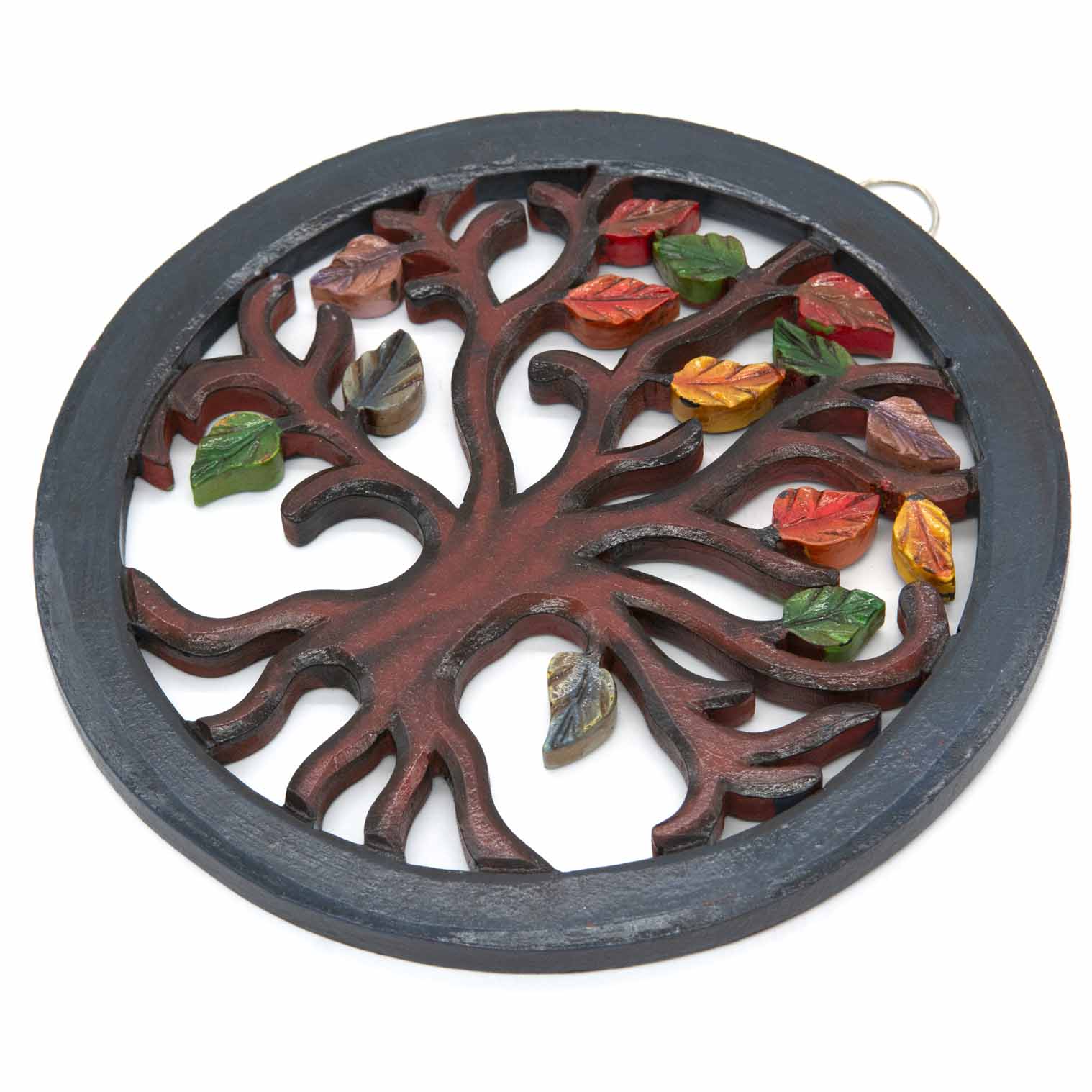 Tree of Life circle plaque at an angle showing depth of carved trunk and individually attached painted leaves