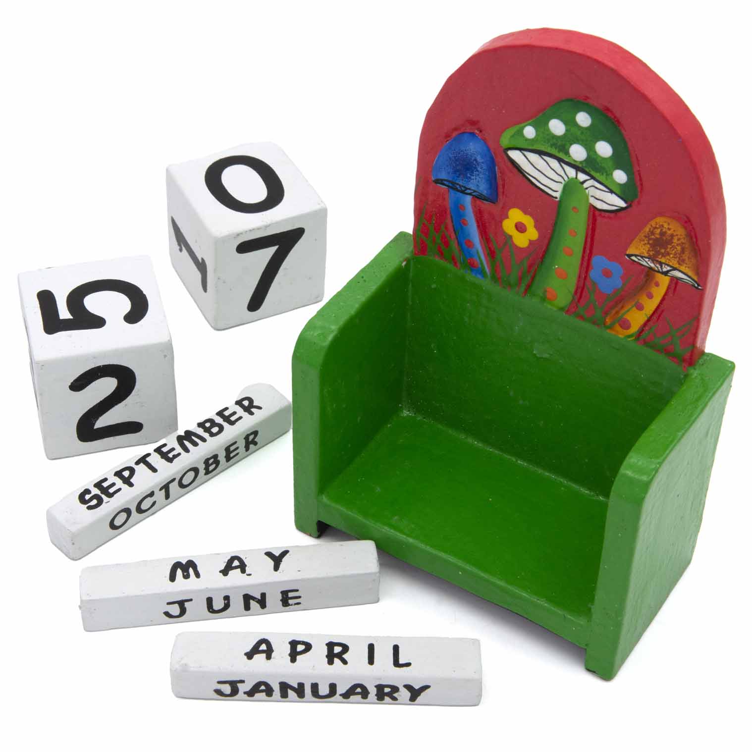 Mushroom calendar components laid out: green stand, white date cubes and month bars, Indonesia