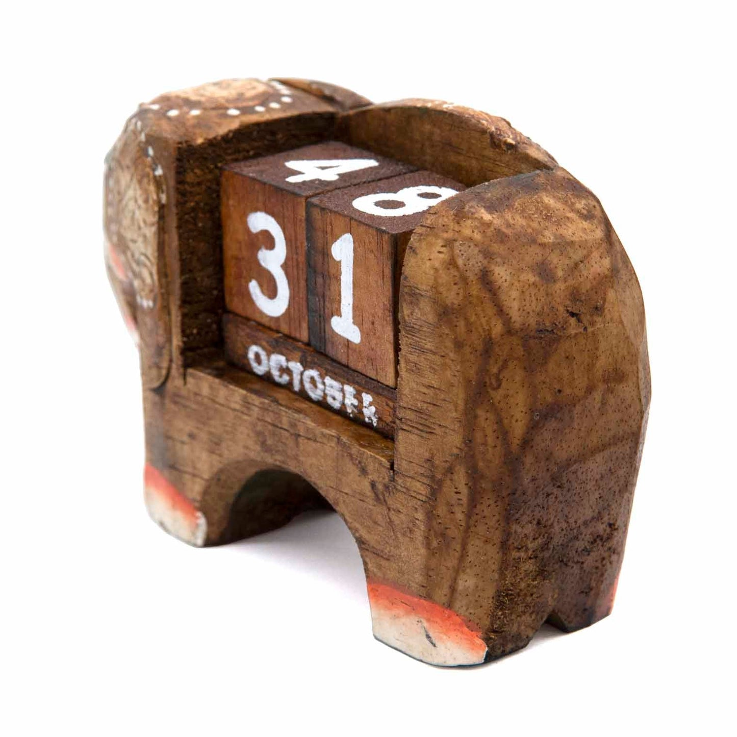 Rear view of small carved wooden elephant calendar showing grain texture and block housing, Indonesia