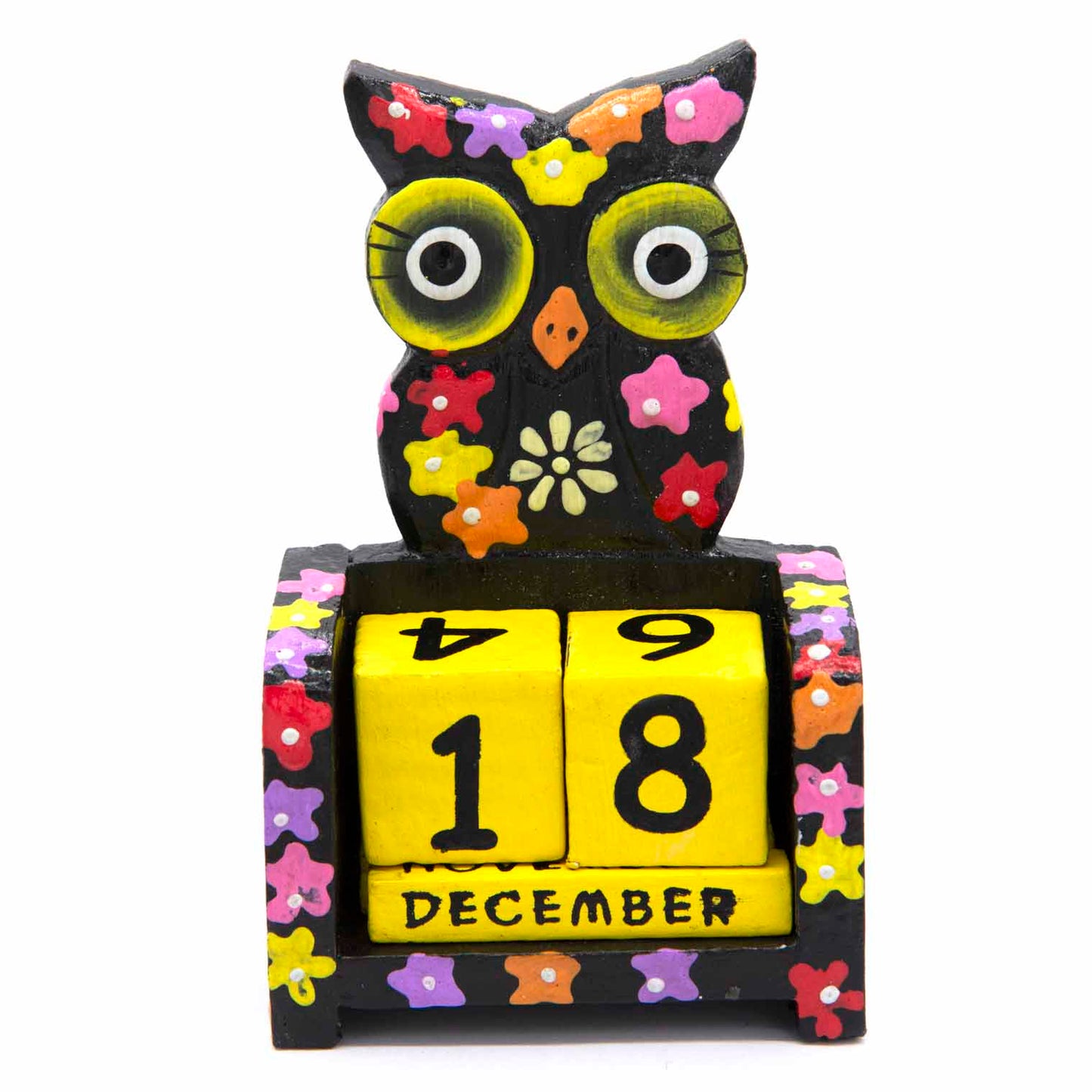 Hand-painted black wooden owl calendar with yellow date blocks showing December, front view on white