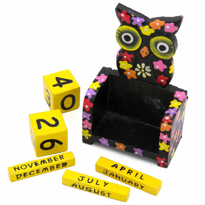 Black owl calendar with yellow date blocks and month bars removed, showing full component set