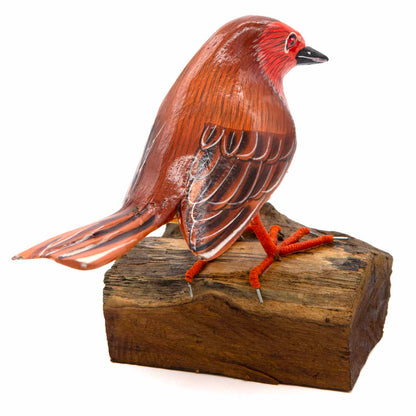 Painted wooden robin, three-quarter view showing red head and brown wing markings