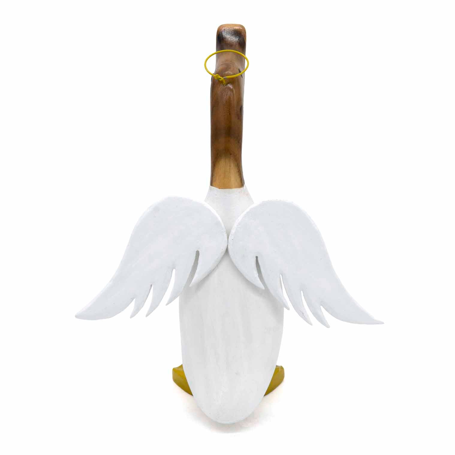 Rear view of angel bamboo root duck showing carved white wings spread from the body, gold feet, Indonesia