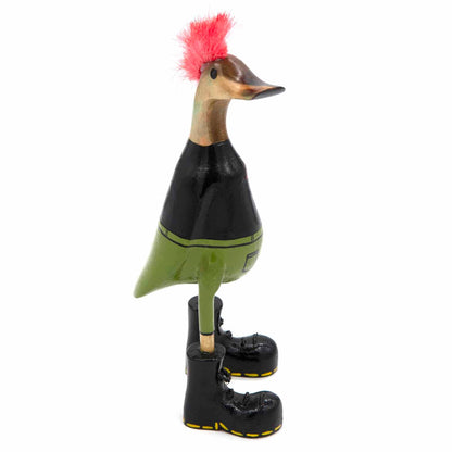 Side view of punk bamboo root duck showing red mohawk, black jacket and green trousers, Indonesia