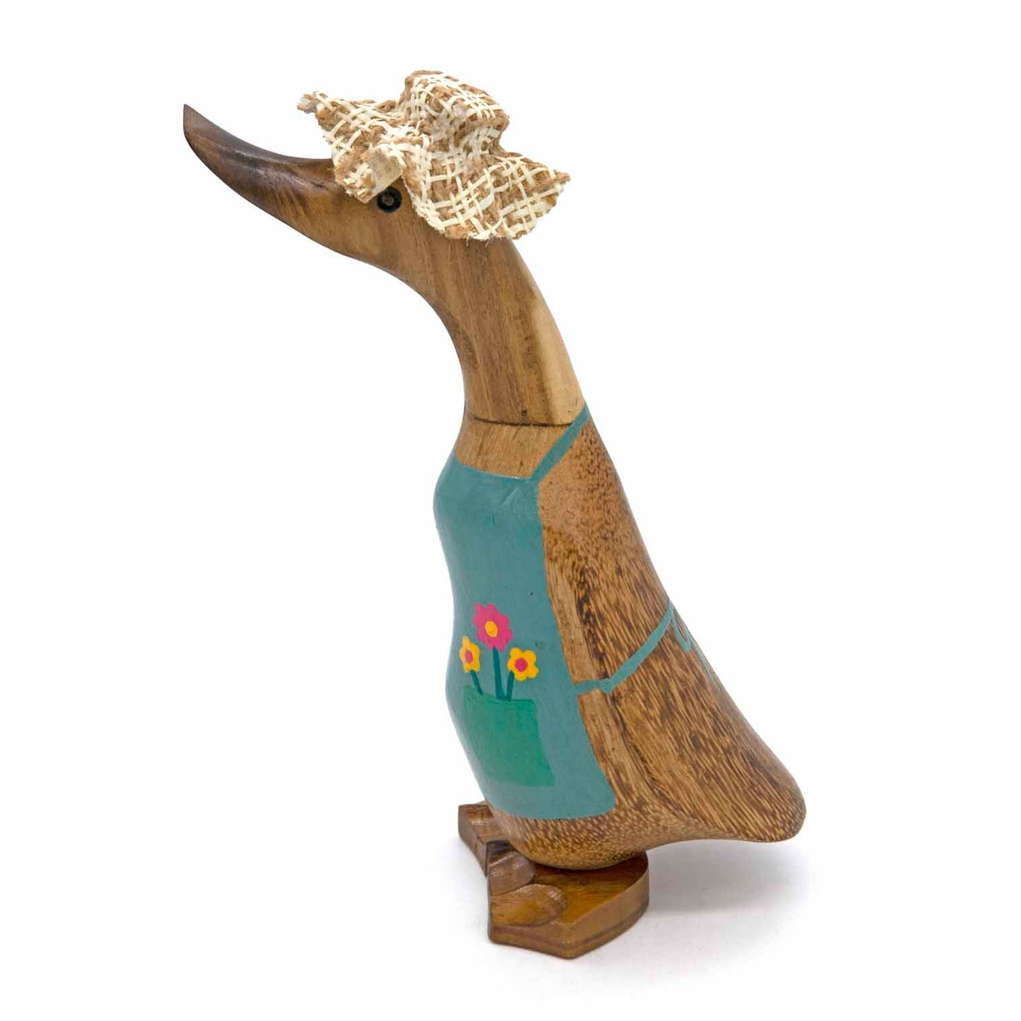 Side view of gardening bamboo root duck showing straw hat, teal apron and natural bamboo body, Indonesia