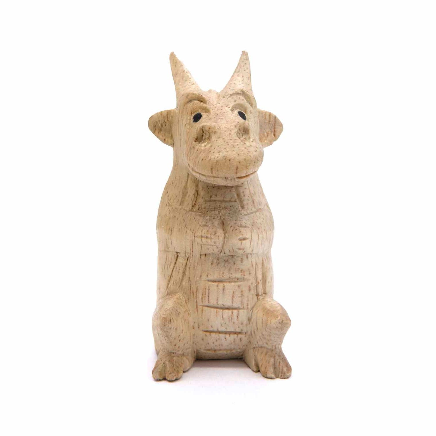 Small Albizia wood dragon figurine, front view showing expressive face and ridged chest