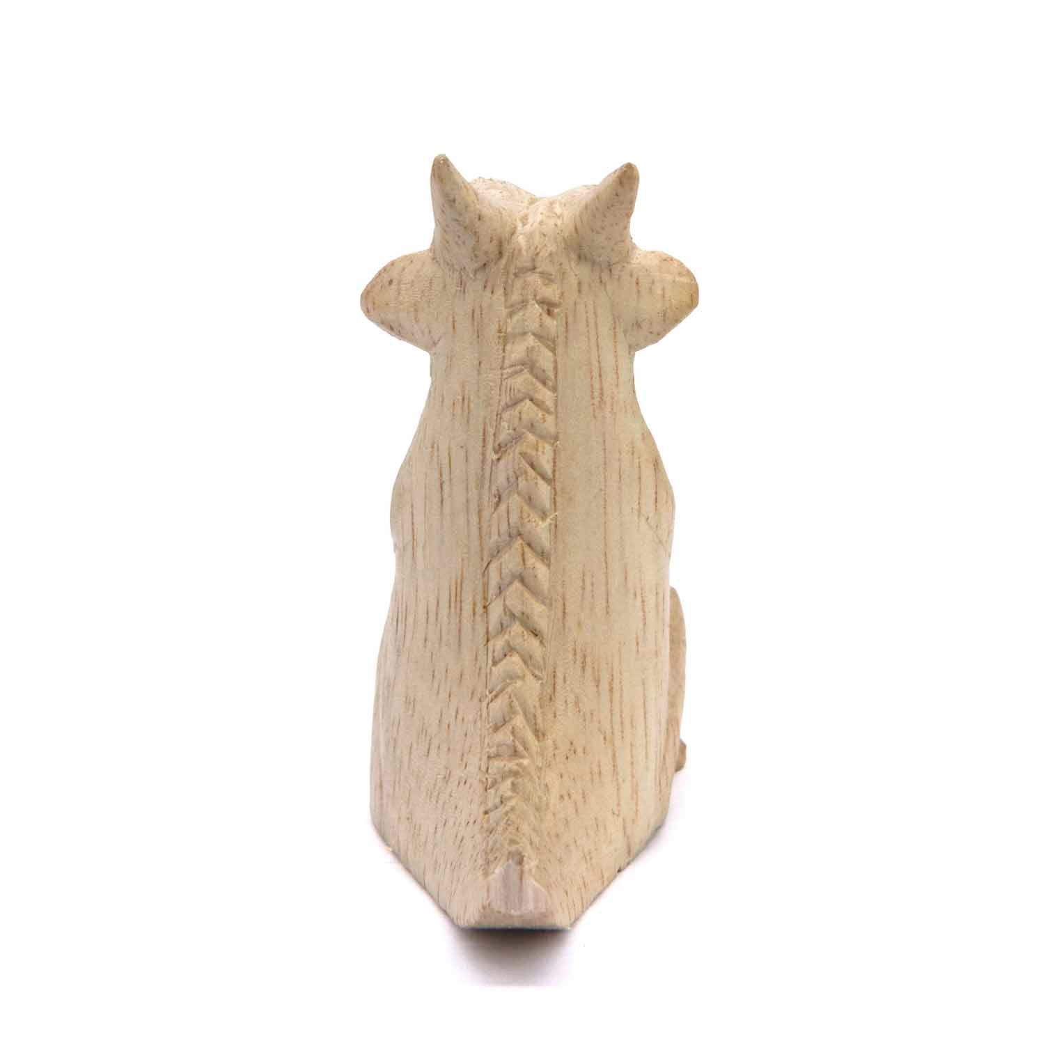Albizia wood dragon carving, rear view showing carved herringbone spine detail