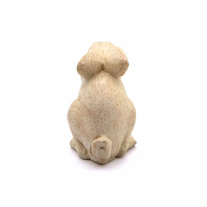 Mini rabbit carving, rear view showing smooth pale wood and tail, Indonesia