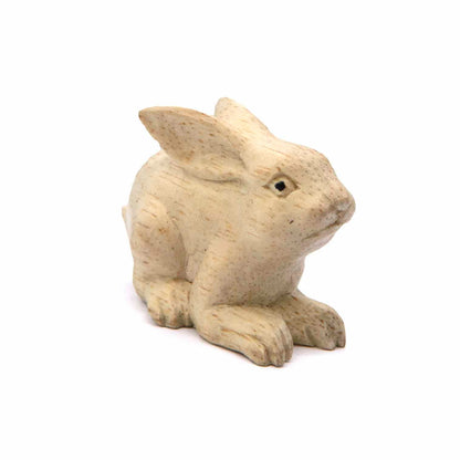 Small Indonesian wood rabbit carving, three-quarter view showing rounded body and ear detail