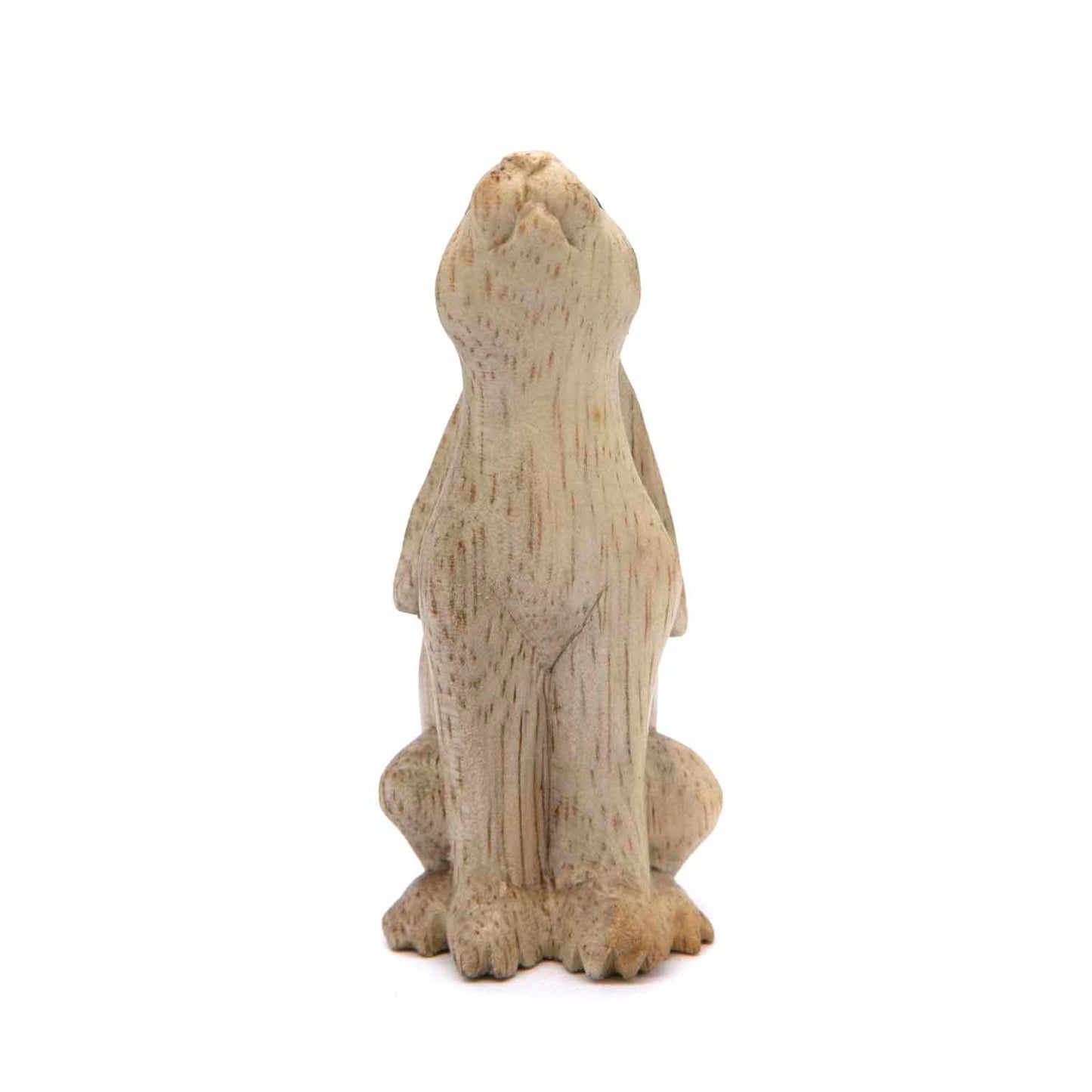 Small carved hare figurine, rear view showing smooth pale wood body and flat ears