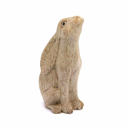 Moon gazing hare wood carving, three-quarter front view showing upturned nose and grain detail