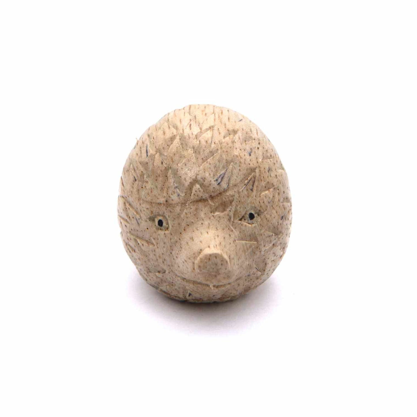 Mini hedgehog wood carving, front view showing face and nose, Indonesia