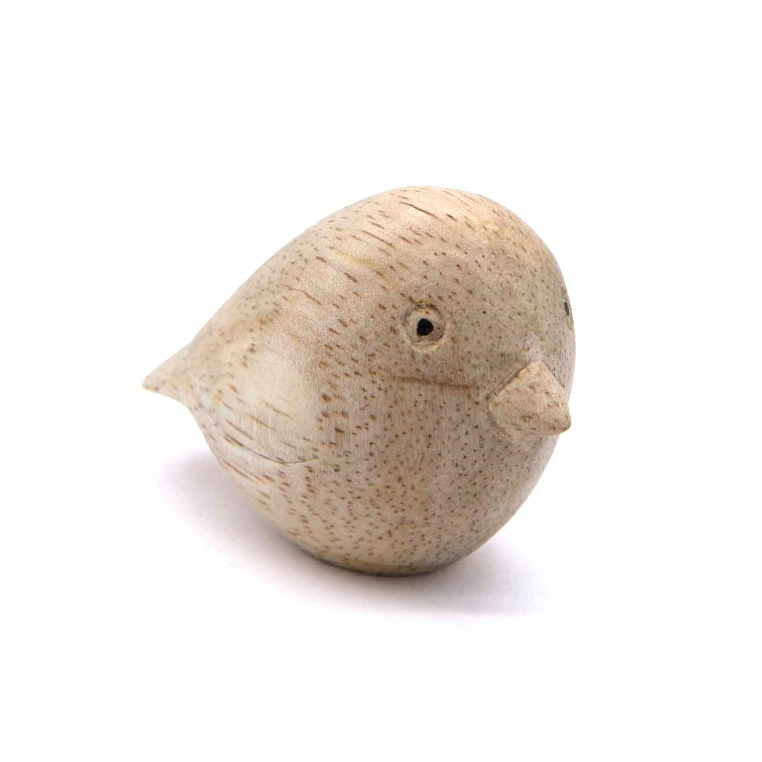 Mini wood bird carving, three-quarter view showing body grain and flat tail, Indonesia