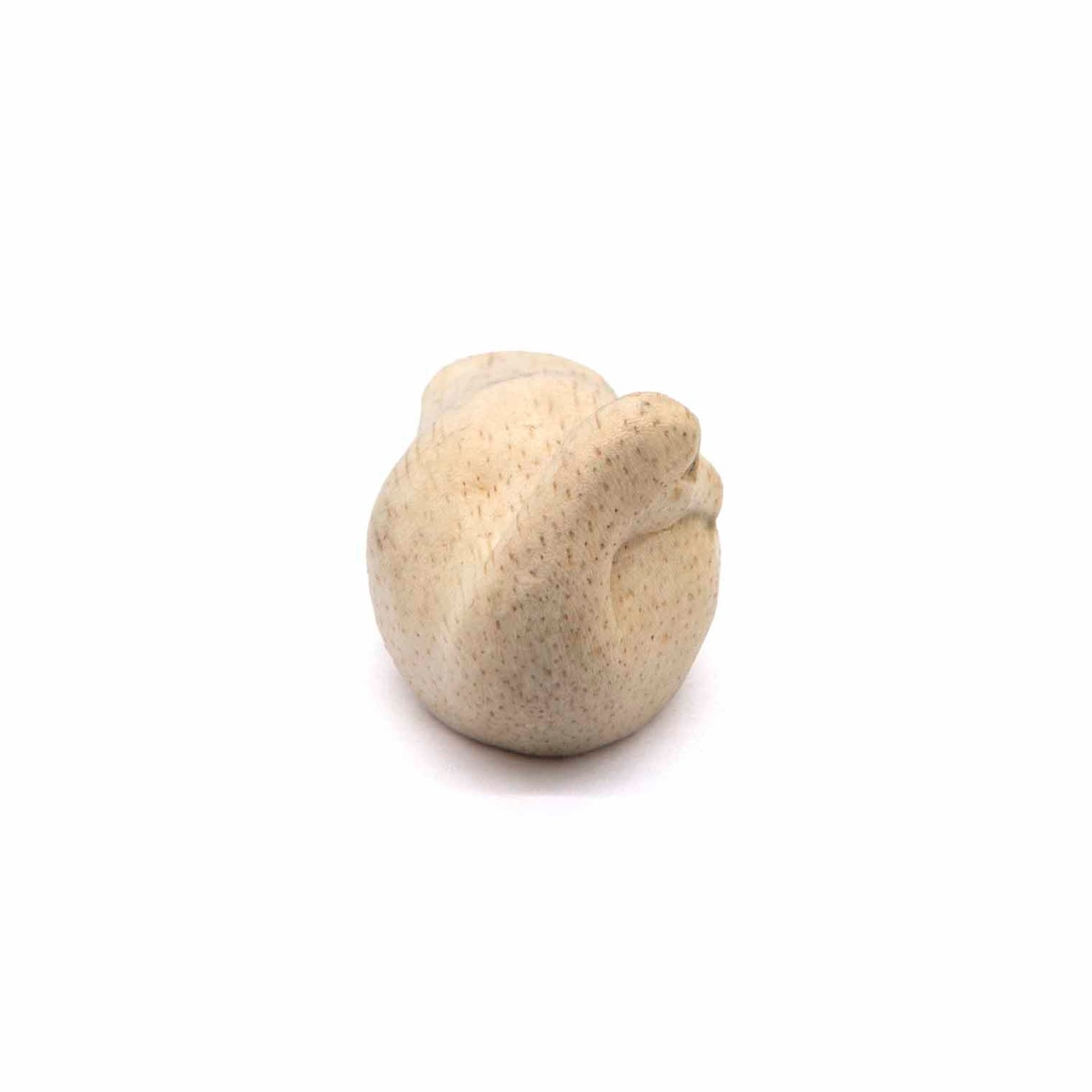 Albizia wood sleeping duck carving viewed from above, showing rounded back and grain detail