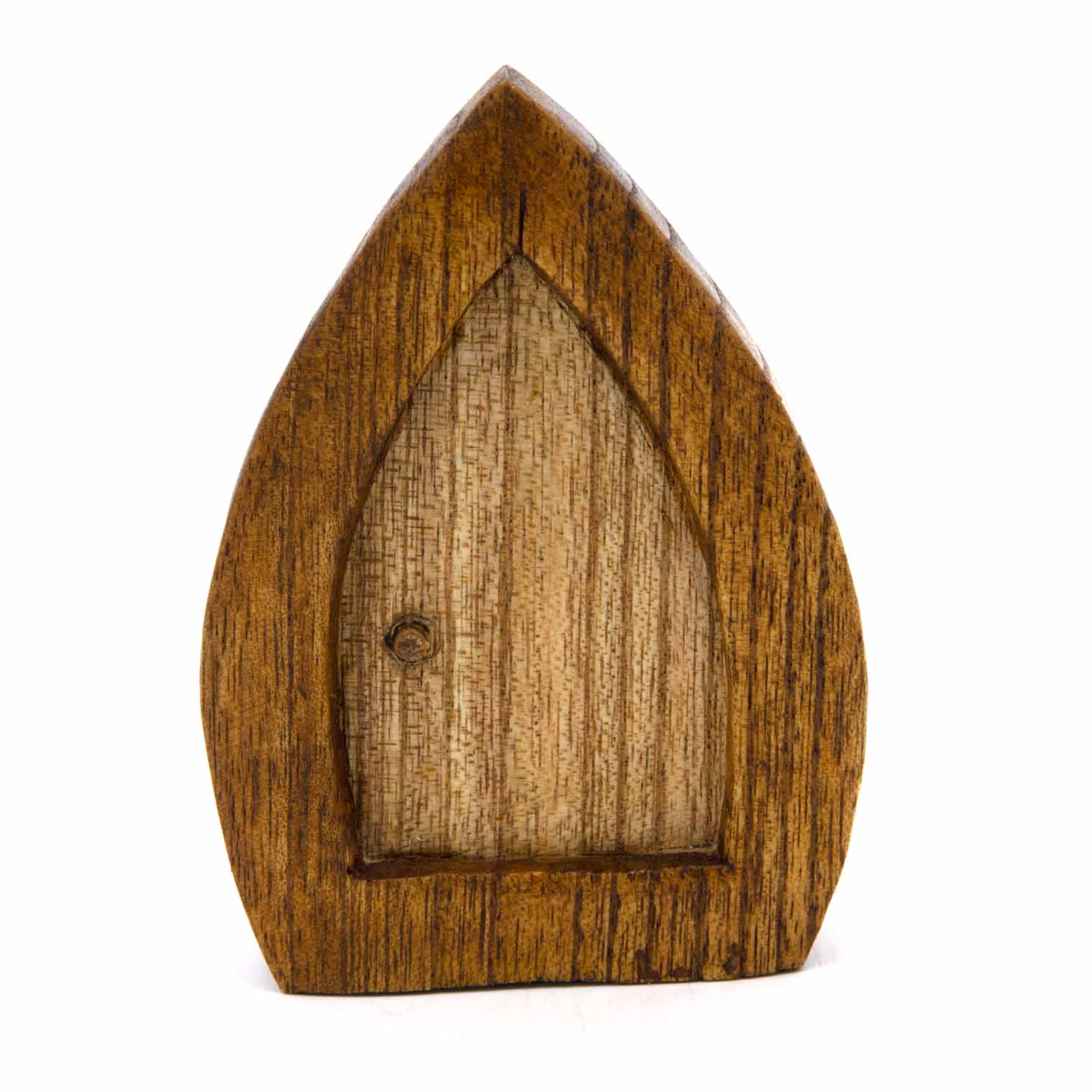 Wooden fairy door carving, front view showing pointed arch frame and vertical grain