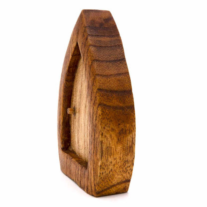 Fairy door carving, side profile showing depth of carved frame and recessed door panel