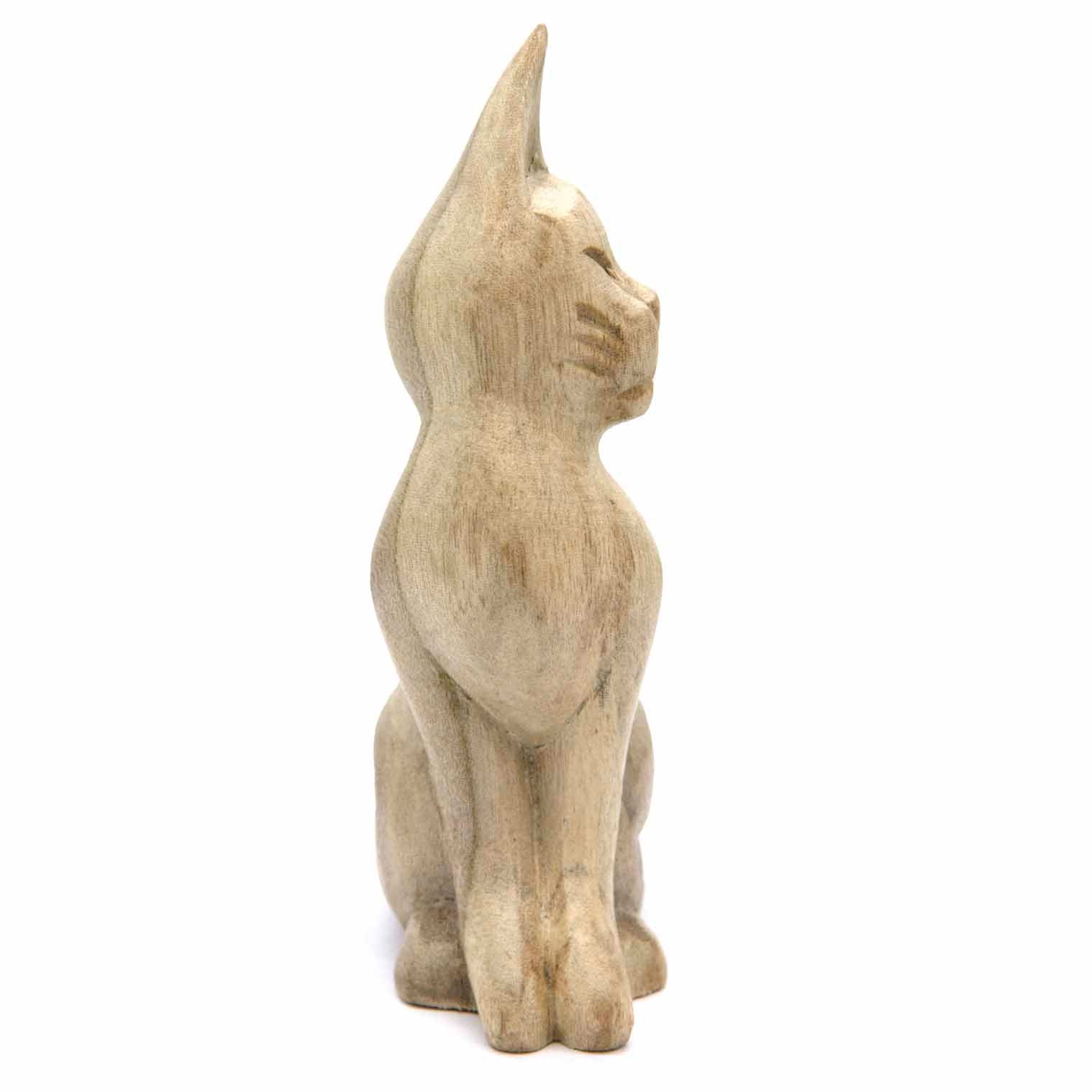 Carved pale wood cat, side view showing upright posture and bleached grain finish