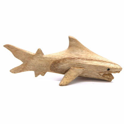 Horizontal wooden shark carving in natural amber-stained finish with visible grain and swept tail