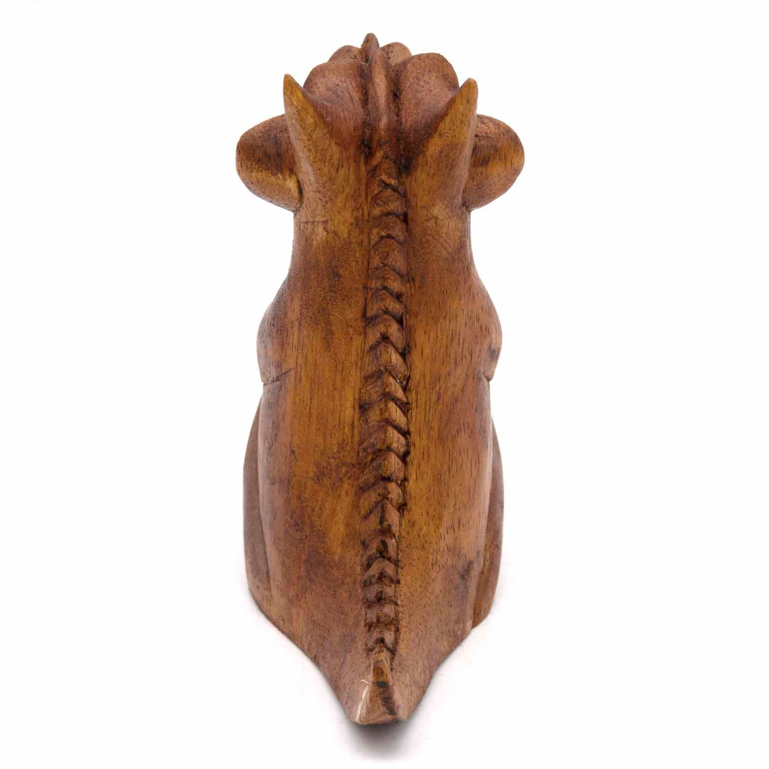 Dragon wood carving, rear view showing herringbone spine ridge in amber-stained wood