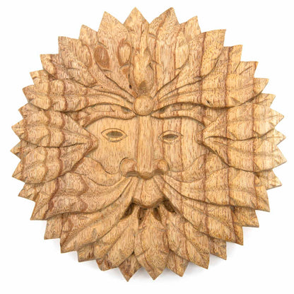 Front view of round Green Man carved wood plaque on white background, pale natural stain showing grain through leaves