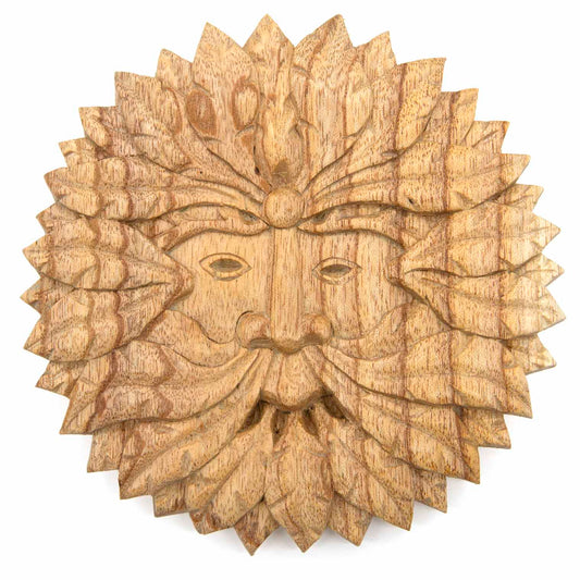 Front view of round Green Man carved wood plaque on white background, pale natural stain showing grain through leaves