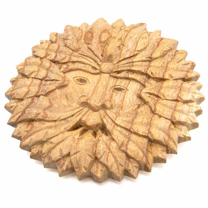 Green Man wood plaque at an angle on white background showing 1cm depth and layered leaf carving