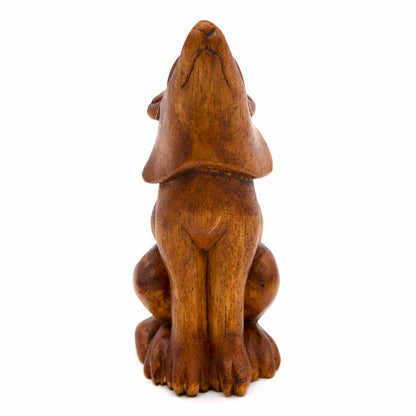 Hand-carved wolf figurine, rear view showing smooth amber wood body and folded ears