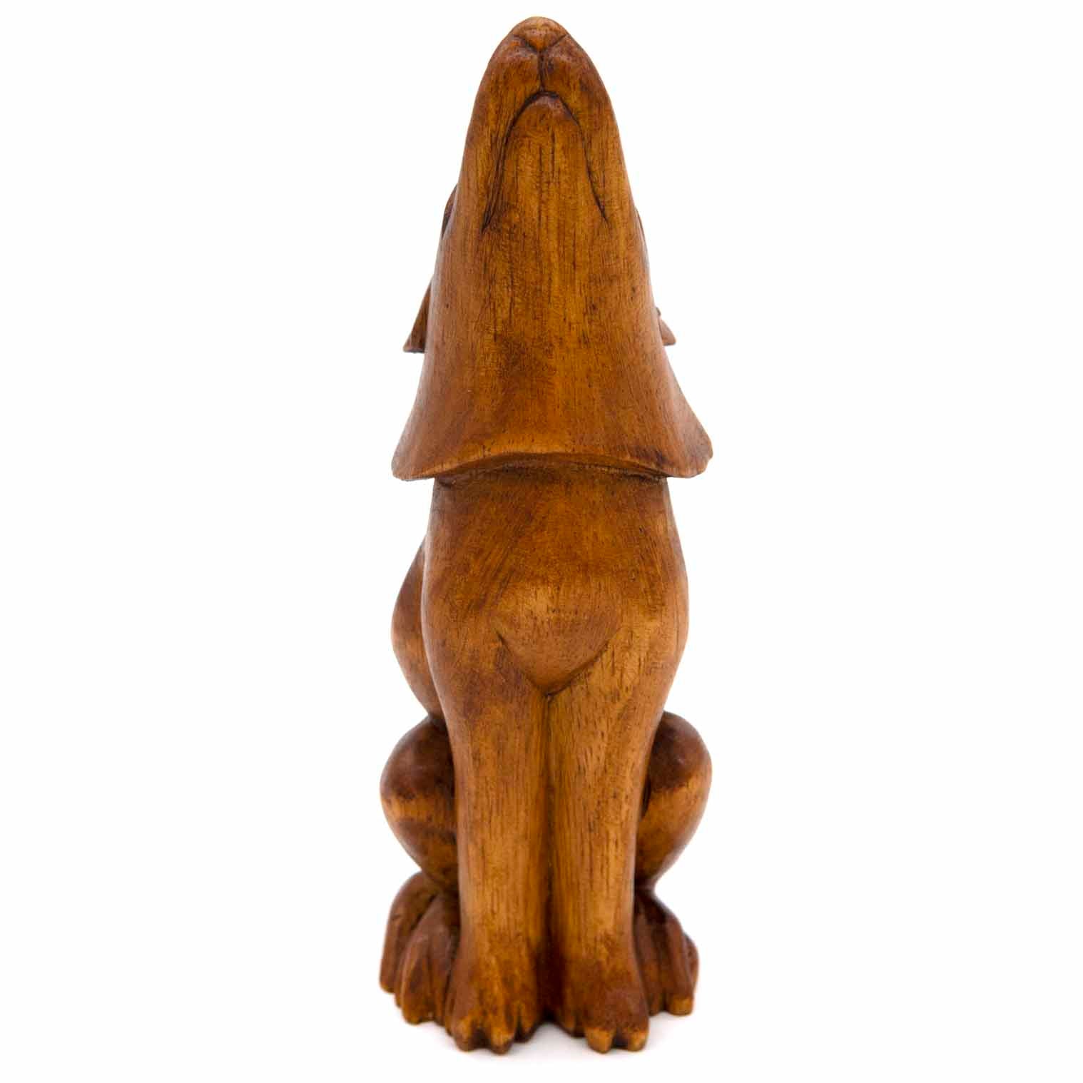 Hand-carved large wolf figurine, rear view showing smooth amber wood back and folded ears