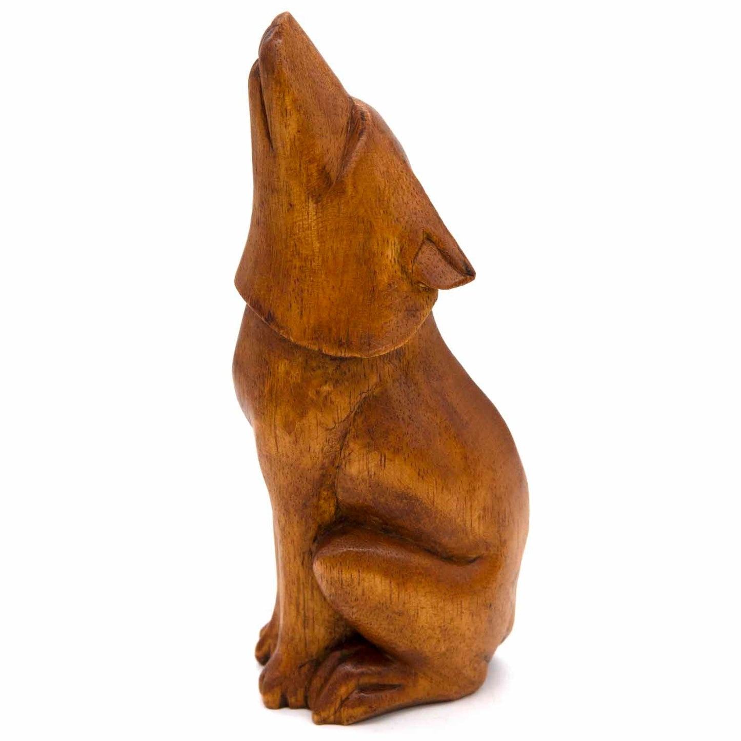 Large howling wolf carving, three-quarter side view showing full seated body, Indonesia