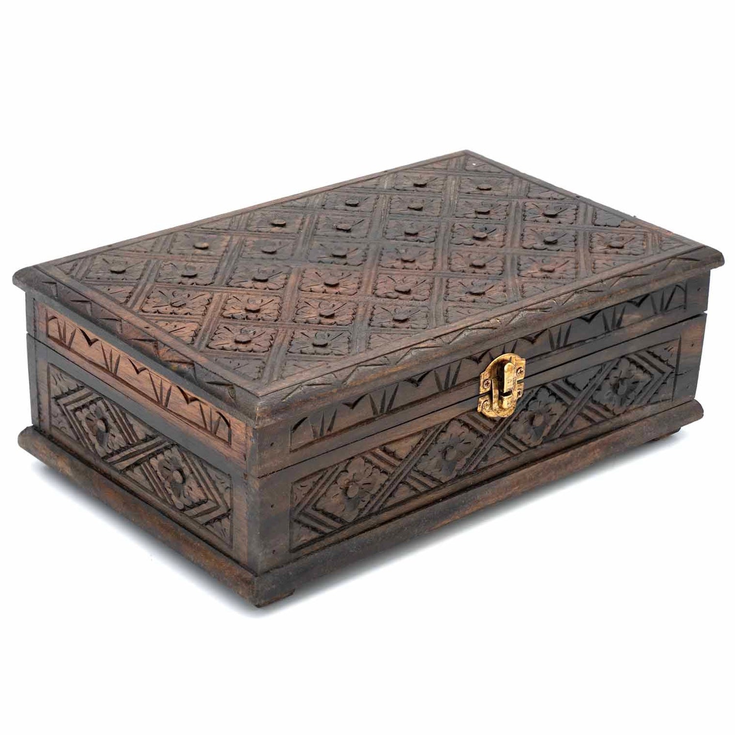 Three-quarter view of carved wooden jewellery box showing geometric floral pattern across lid and sides