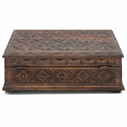 Rear view of carved wood jewellery box showing metal hinges and continuous diamond relief carving on back panel