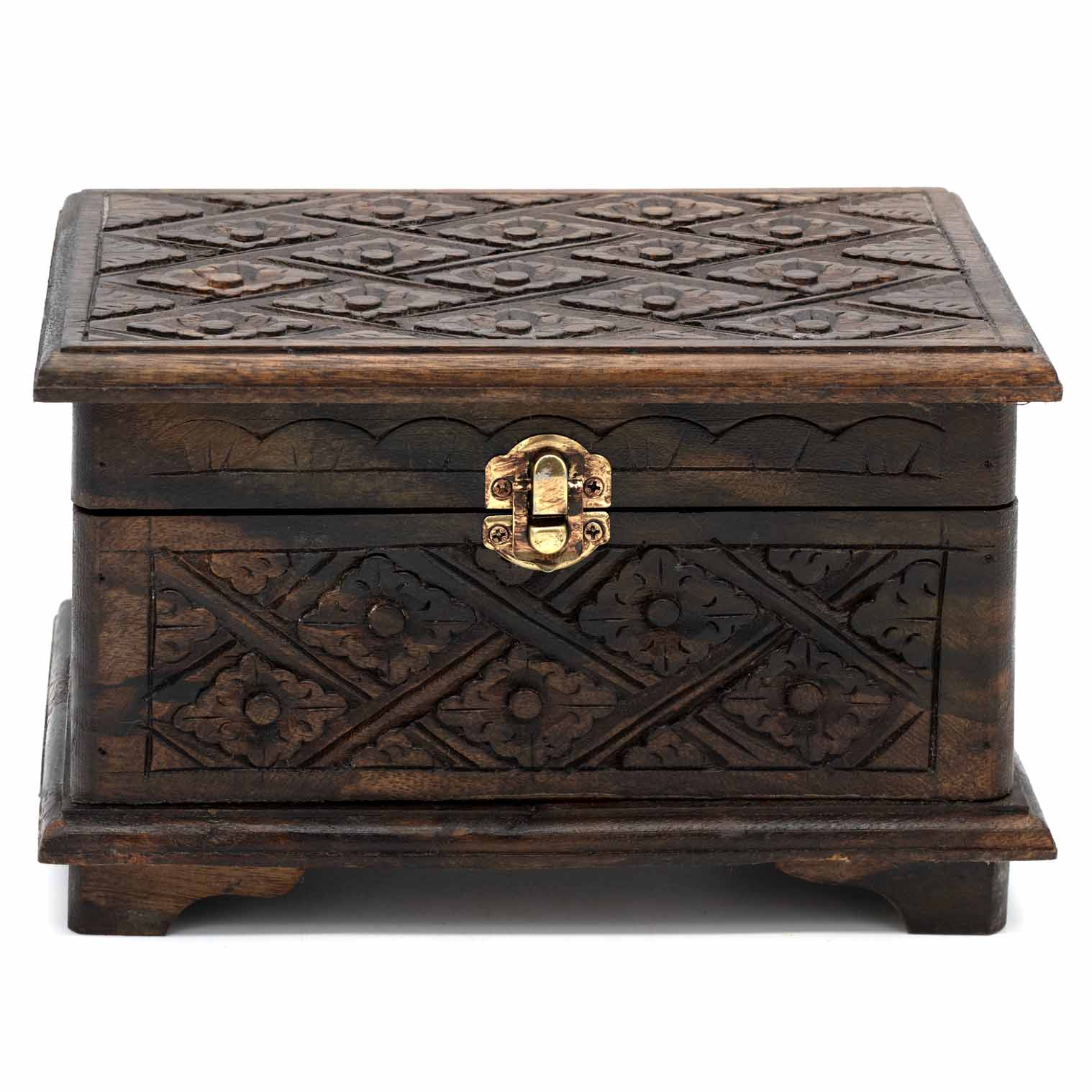 Small carved wood jewellery chest on bracket feet, front view showing brass clasp and diamond-flower relief carving