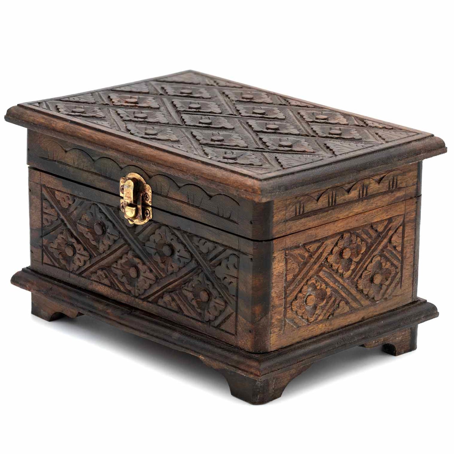 Three-quarter front view of carved jewellery chest showing pitched lid profile and deep brown stained finish