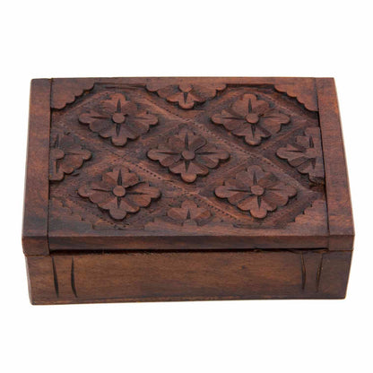 Three-quarter view of carved wood card box showing plain smooth sides and friction-hinge lid, white background