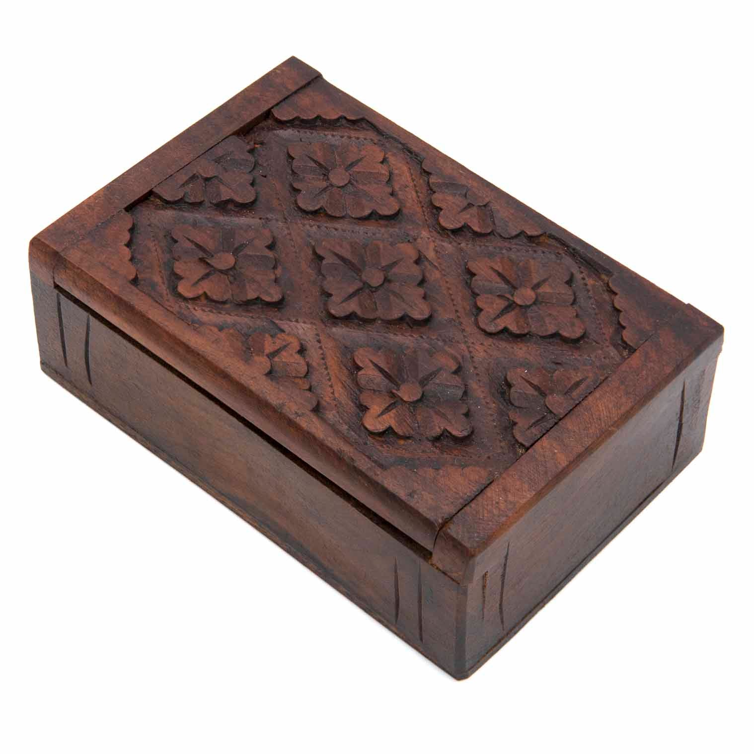 Side-angle view of carved wooden playing card box showing lid profile and plain dark-stained sides