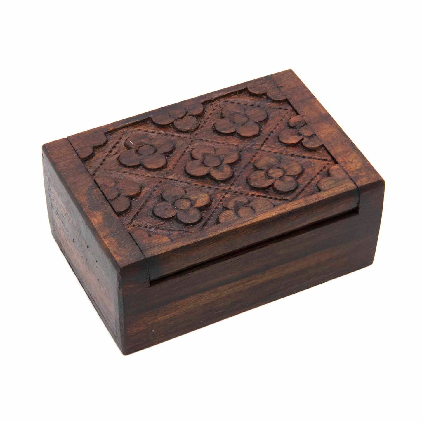 Mini carved wood box closed, three-quarter view showing four-flower diamond grid on lid, dark stained finish, Indonesia